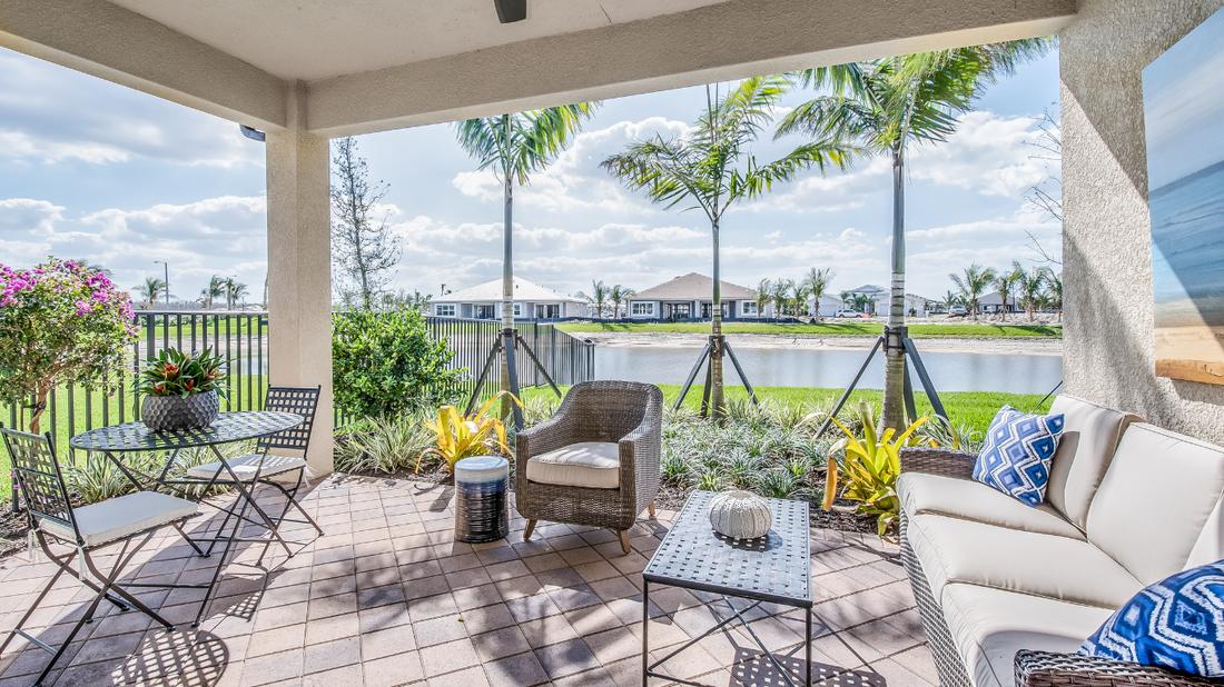 Luxury outdoor living space with Maybach-inspired sunglasses resting on a modern patio table