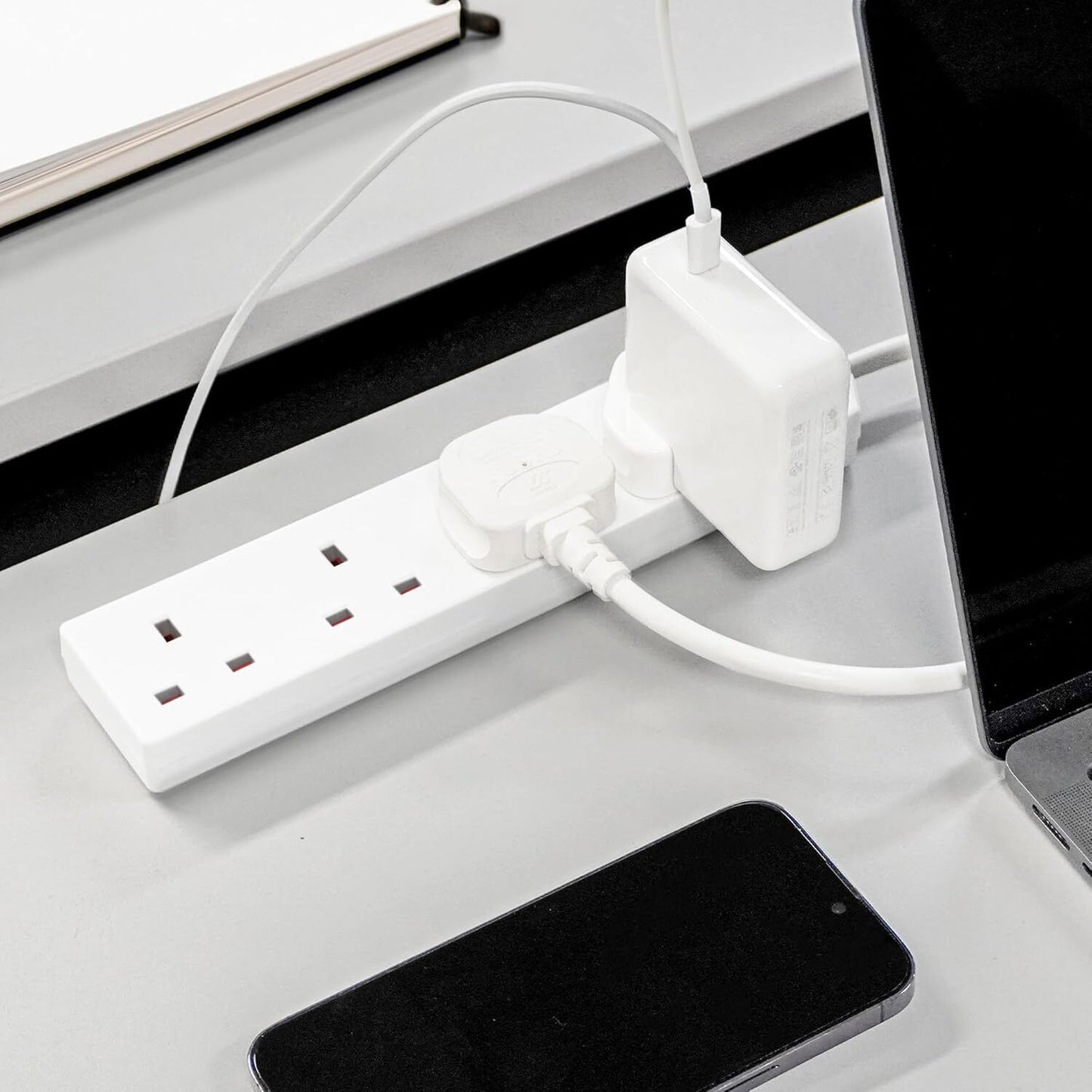 Black 4-Gang Extension Lead with 1M Cable, UK Plug, and Wall Mount Capability