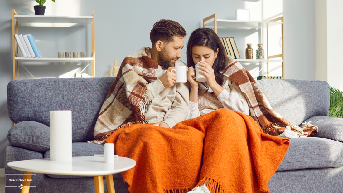 A person wrapped in a heated blanket, holding a steaming mug, with a cozy ambiance.